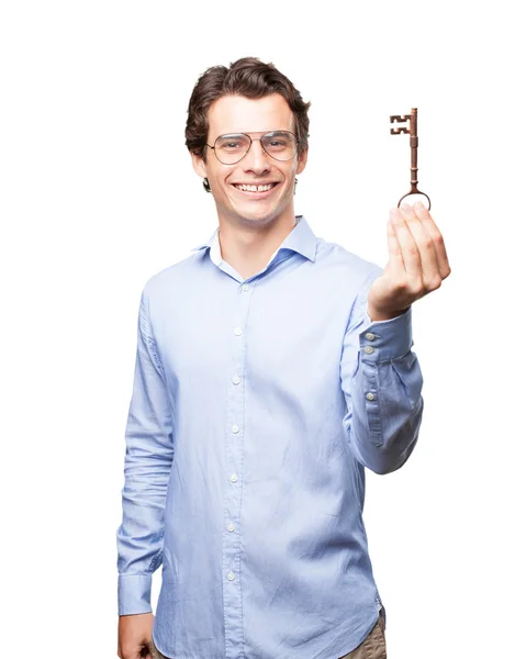 Happy young man with vintage key — Stock Photo, Image