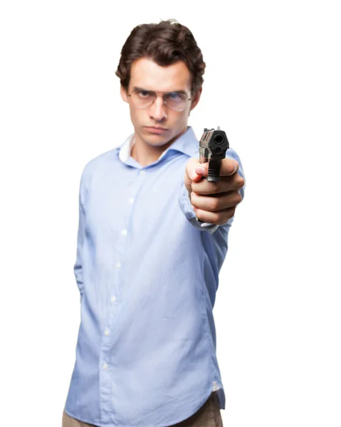 Angry young man with gun — Stock Photo, Image