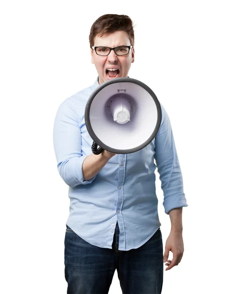Arrabbiato giovane uomo con megafono — Foto Stock