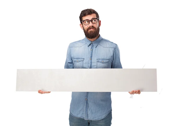 Happy young man with placard — Stock Photo, Image