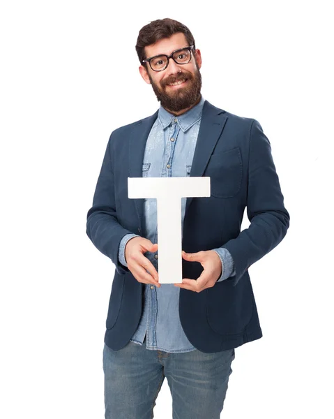 Happy businessman holding letter T — Stock Photo, Image