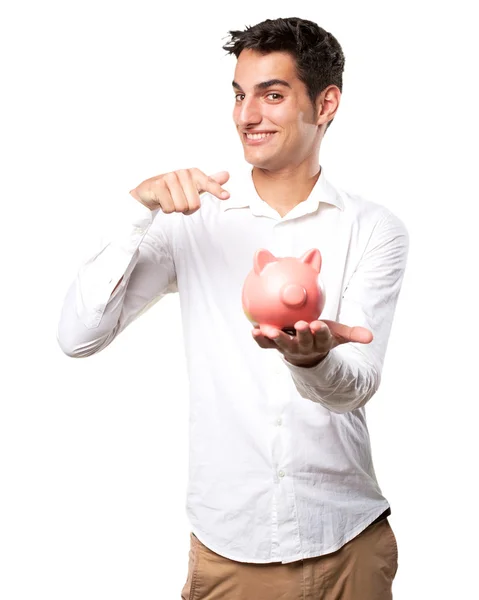 Gelukkige jongeman met spaarvarken bank — Stockfoto