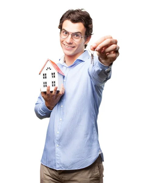 Man with house model and key — Stock Photo, Image