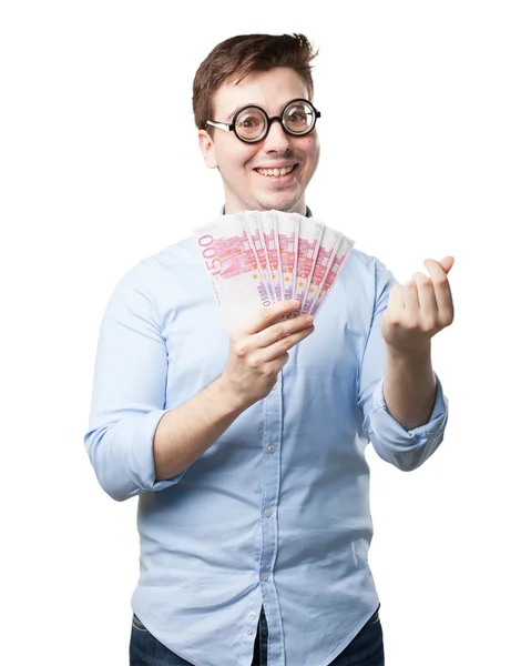 Happy young man with bills — Stock Photo, Image