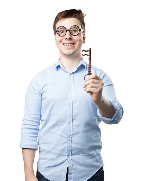 Happy young man with vintage key — Stock Photo, Image