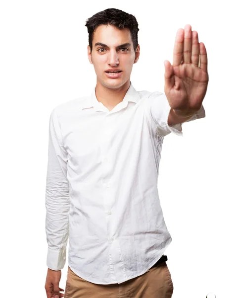 Confused young man with stop gesture — Stock Photo, Image