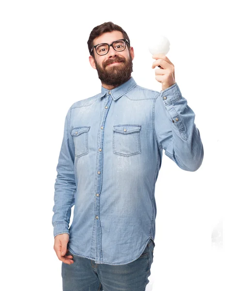 Happy young man with lightbulb — Stock Photo, Image