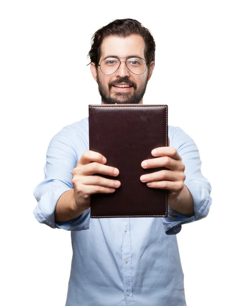 Joven feliz con libro pequeño —  Fotos de Stock