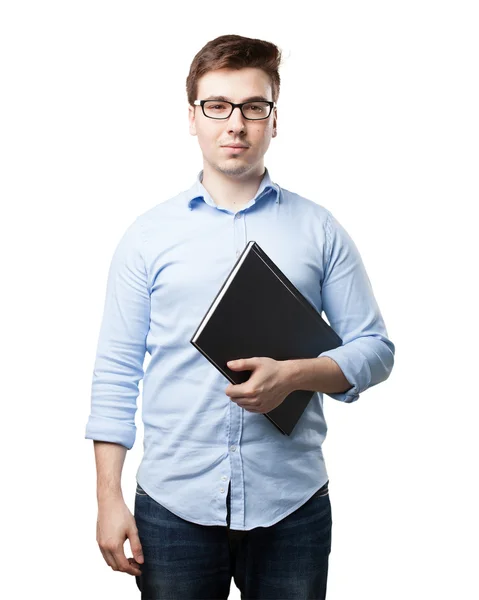 Happy young man with small book Stock Photo