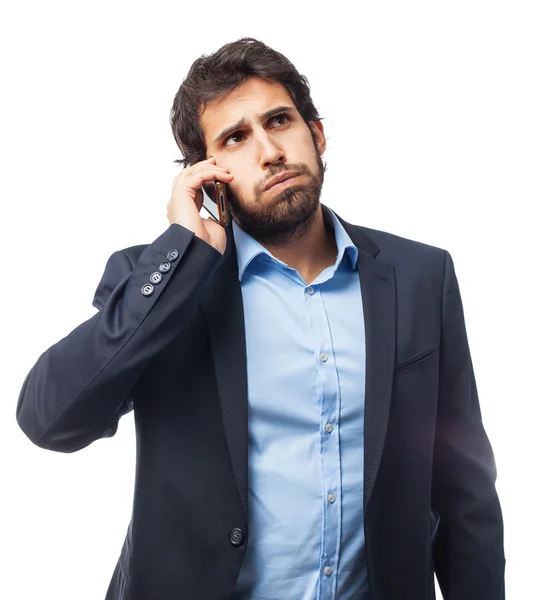 Businessman with mobile boring pose — Stock Photo, Image