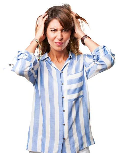 Angry young woman covering ears — Stock Photo, Image