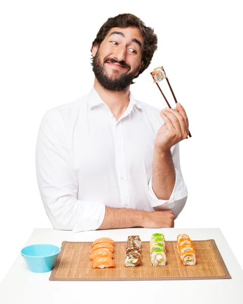 Чоловік їсть суші — стокове фото