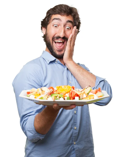 Glücklicher junger Mann mit Salat — Stockfoto