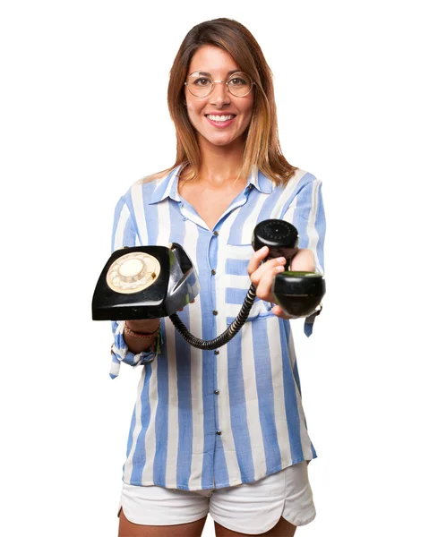 Happy young woman with telephone — Stock Photo, Image