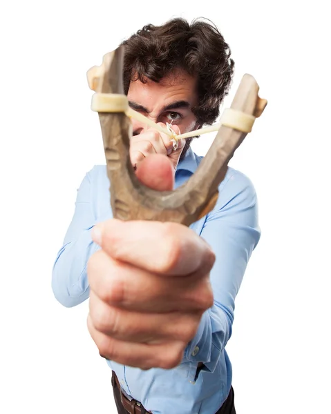 Angry young man with slingshot — Stock Photo, Image