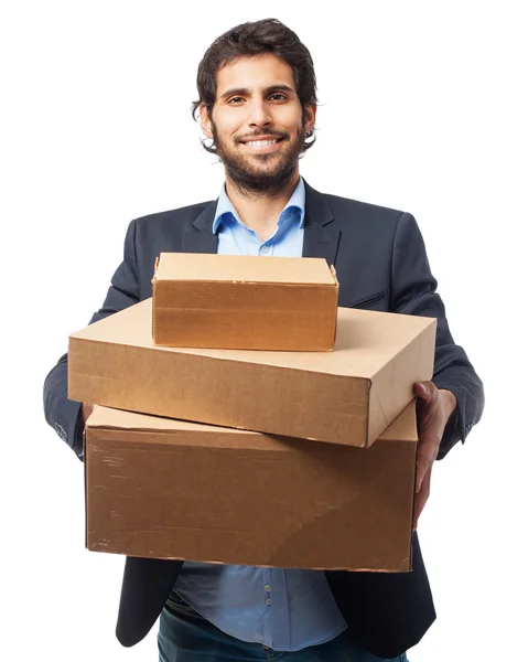Индийский бизнесмен с картонными коробками — стоковое фото