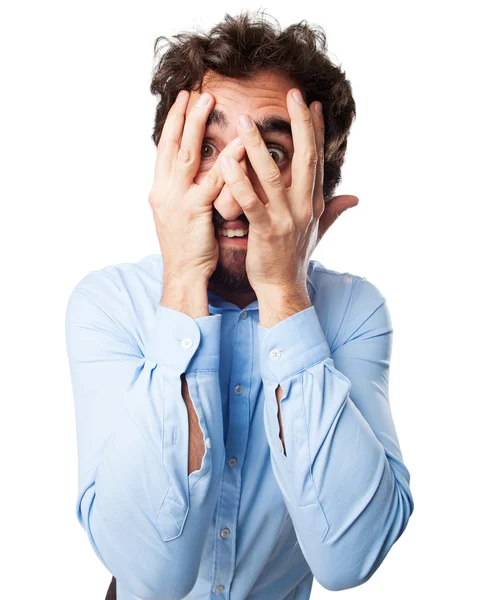 Scared young man covering face — Stock Photo, Image