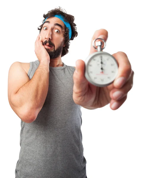 Scared sport man with stopwatch — Stock Photo, Image