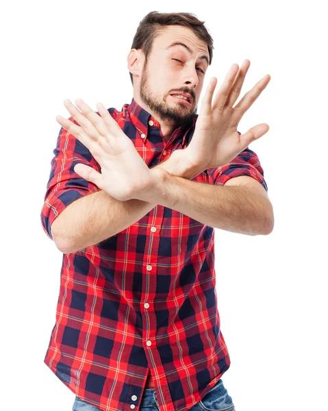 Verängstigter junger Mann verdeckt Gesicht — Stockfoto