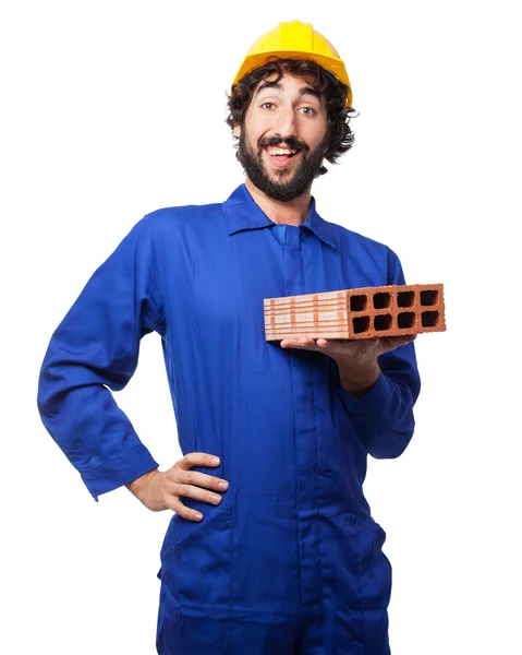 Gelukkig werknemer man met baksteen — Stockfoto