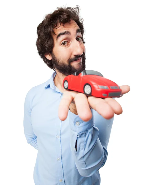 Heureux jeune homme avec voiture rouge — Photo