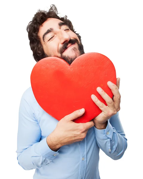 Happy young man with heart shape — Stock Photo, Image