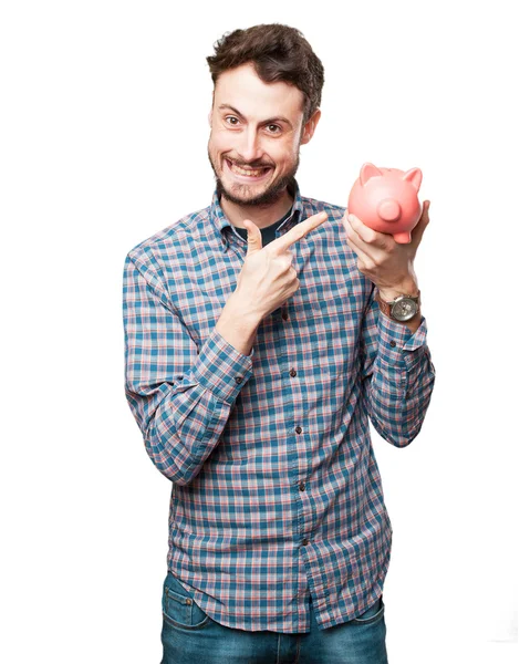 Happy young man with piggy bank — Stock Photo, Image