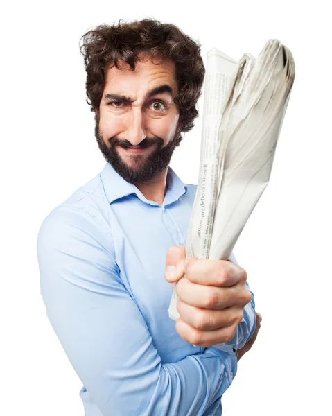 Joven enojado con el periódico — Foto de Stock