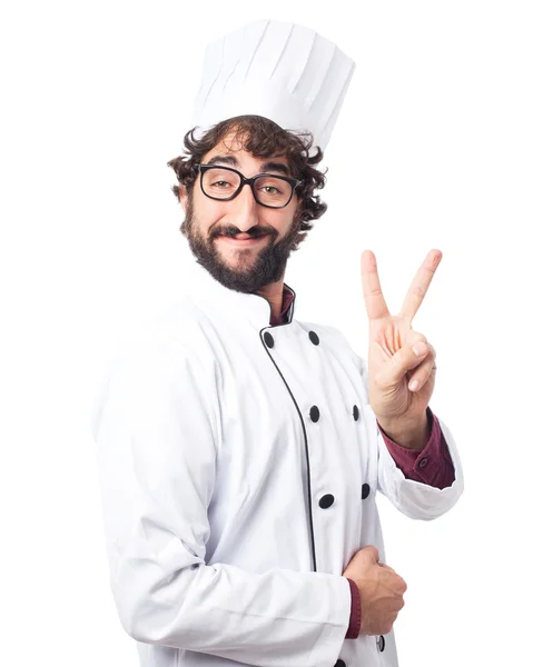 Heureux cuisinier homme signe de victoire — Photo
