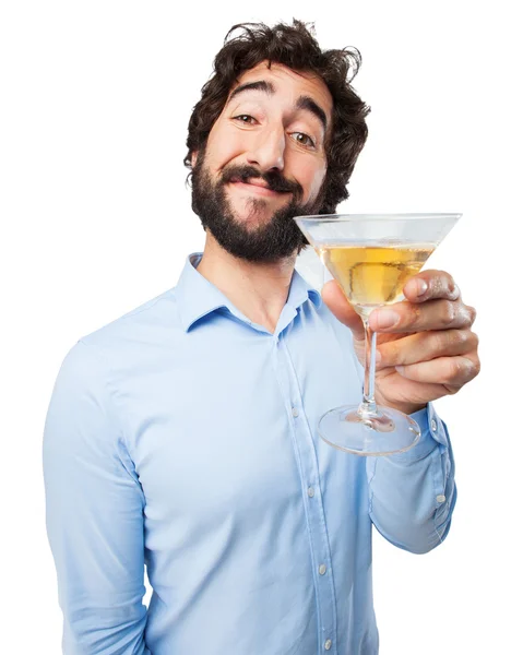 Glücklicher junger Mann mit alkoholischem Getränk — Stockfoto