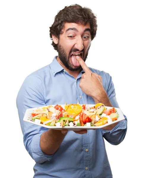 Молодий чоловік знак блювоти з салатом — стокове фото