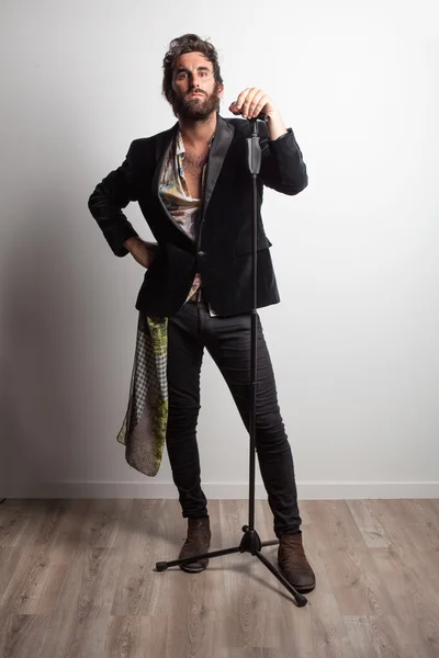 Rock musician posing in studio — Stock Photo, Image