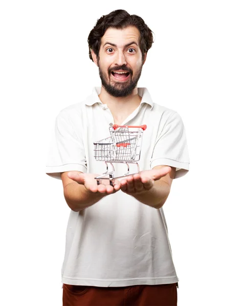 Joven feliz con carrito de compras — Foto de Stock