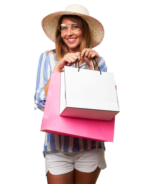 Glückliche junge Frau mit Einkaufstüten — Stockfoto