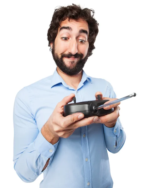 Happy young man with remote control — Stock Photo, Image