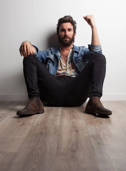 Rock musician sitting on floor — Stock Photo, Image