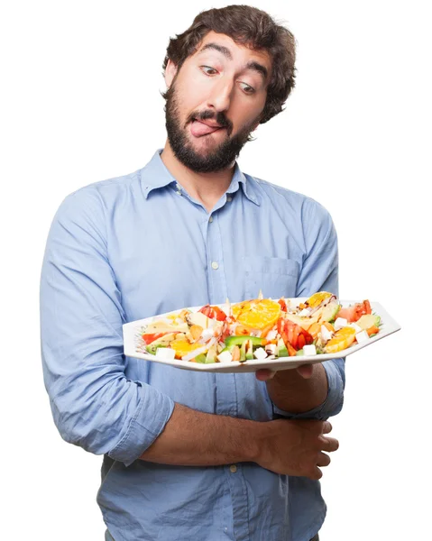 Glücklicher junger Mann mit Salat — Stockfoto