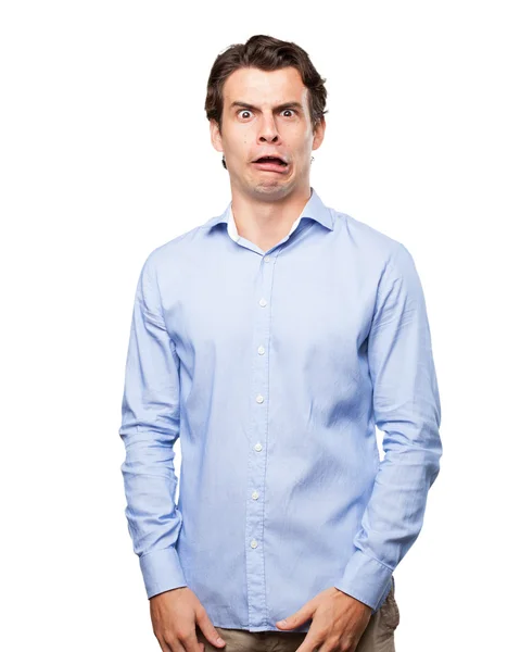 Crazy young man in scared pose — Stock Photo, Image