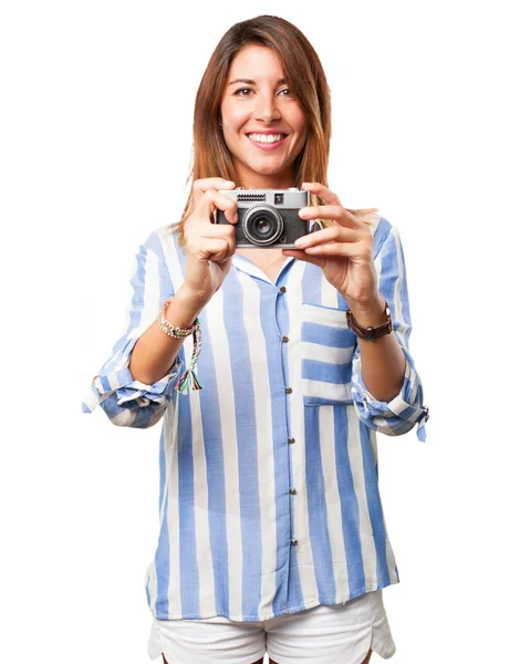 Happy young woman with camera — Stock Photo, Image