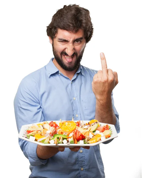 Wütender junger Mann mit Salat — Stockfoto