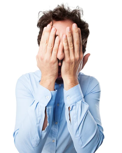 Scared young man covering face — Stock Photo, Image