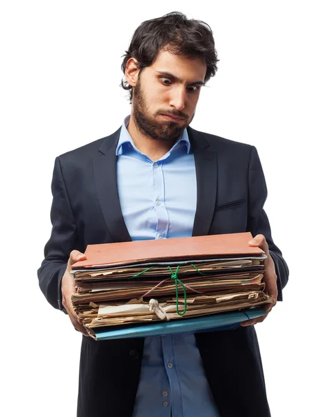 Homem de negócios estressado com arquivos — Fotografia de Stock