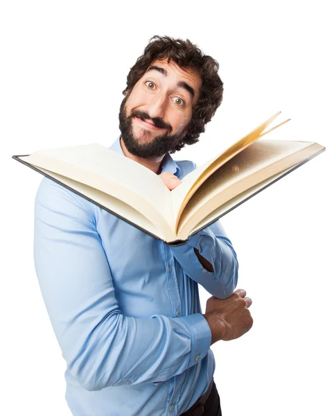 Young man offering small book — Stock Photo, Image