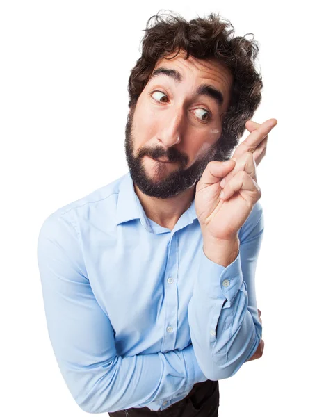 Worried young man cross fingers — Stock Photo, Image