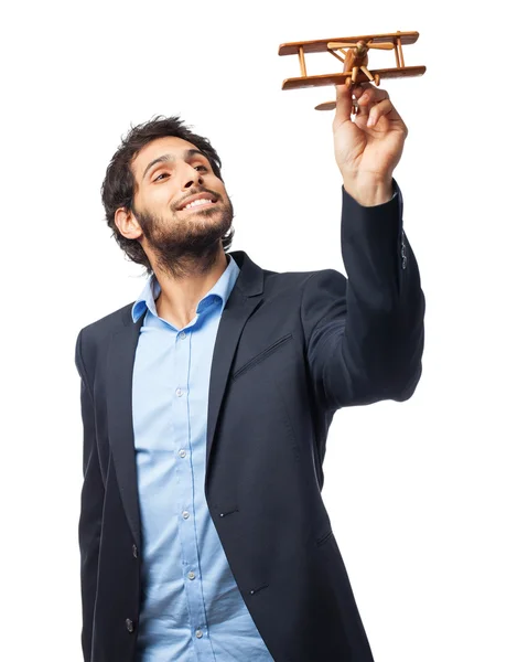 Indian businessman with wooden plane — Stock Photo, Image