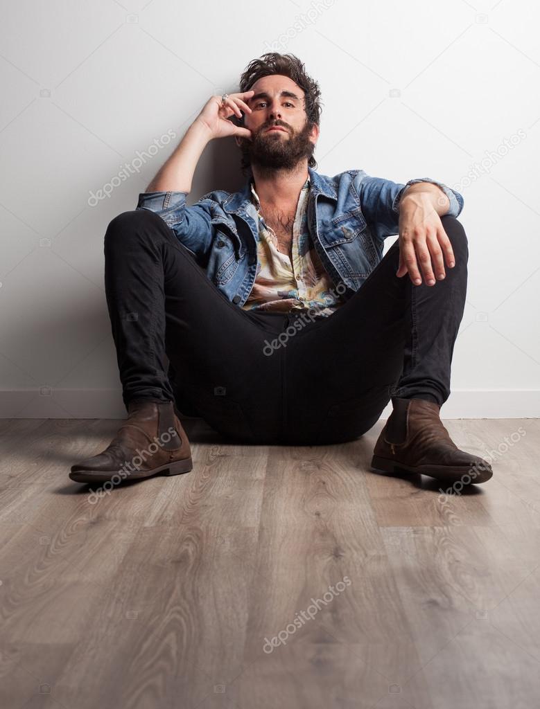 rock musician sitting on floor