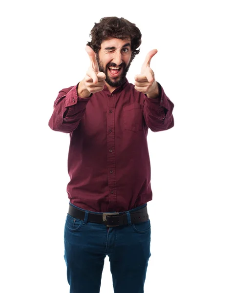 Happy young man pointing front — Stock Photo, Image