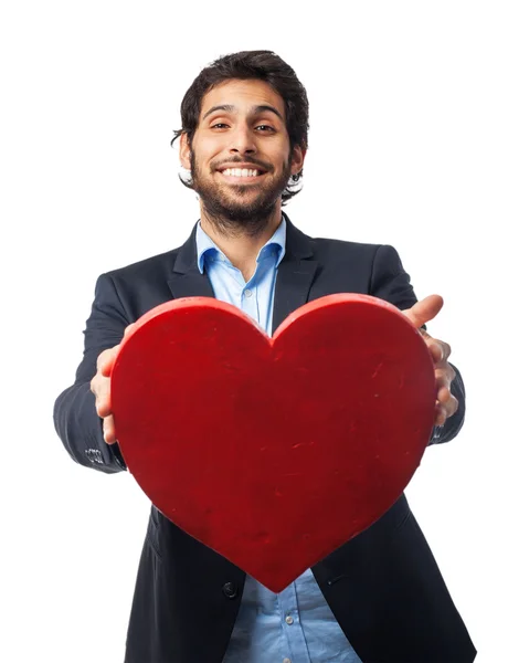 Happy businessman with heart symbol — Stock Photo, Image