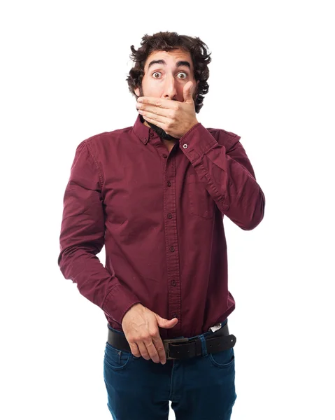 Orolig ung man som täcker munnen — Stockfoto