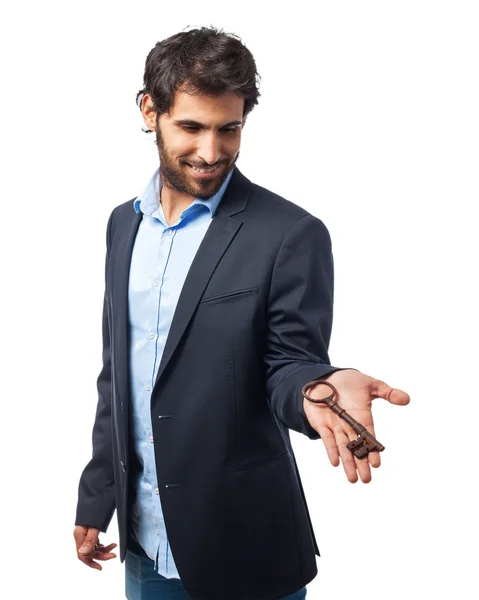 Happy businessman with vintage key — Stock Photo, Image